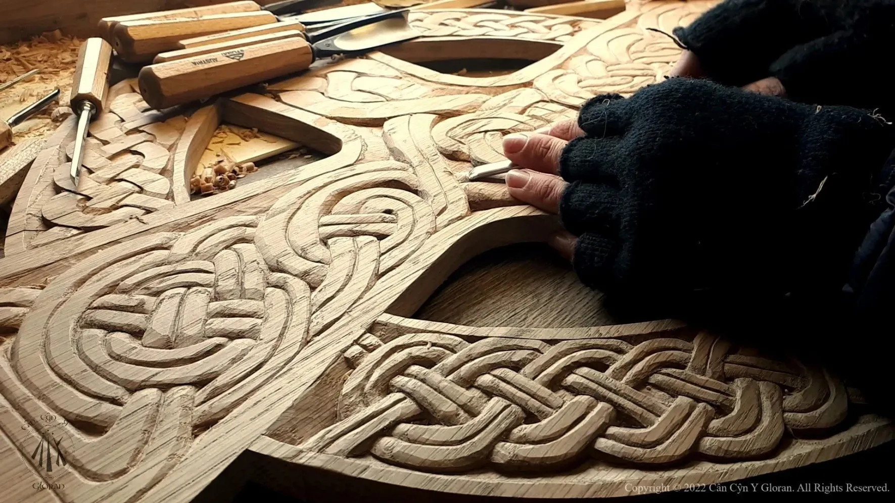 Arwyn of Cân Cŷn y Gloran carving the cross of St. Lawrence's church