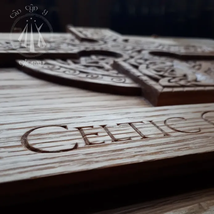 An oak sign, focusing on the hand carved letters 'Celtic'