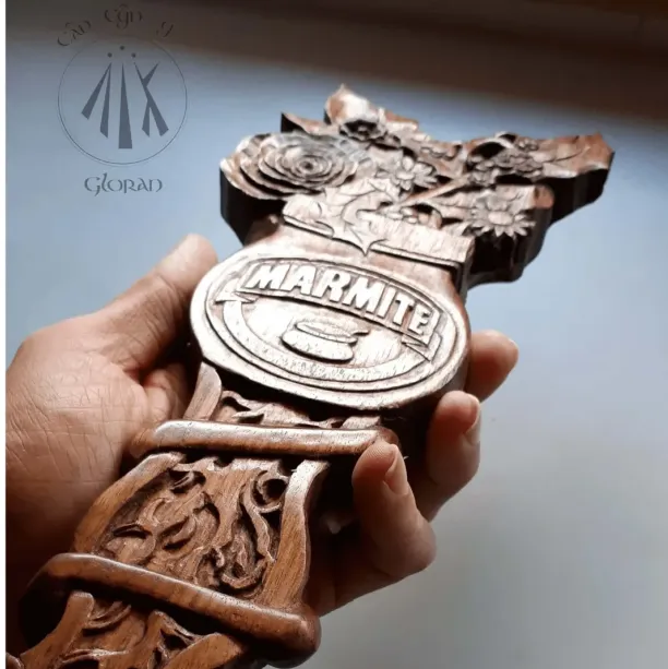 A custom made lovespoon featuring flowers, roots, and a marmite jar carved out of black walnut