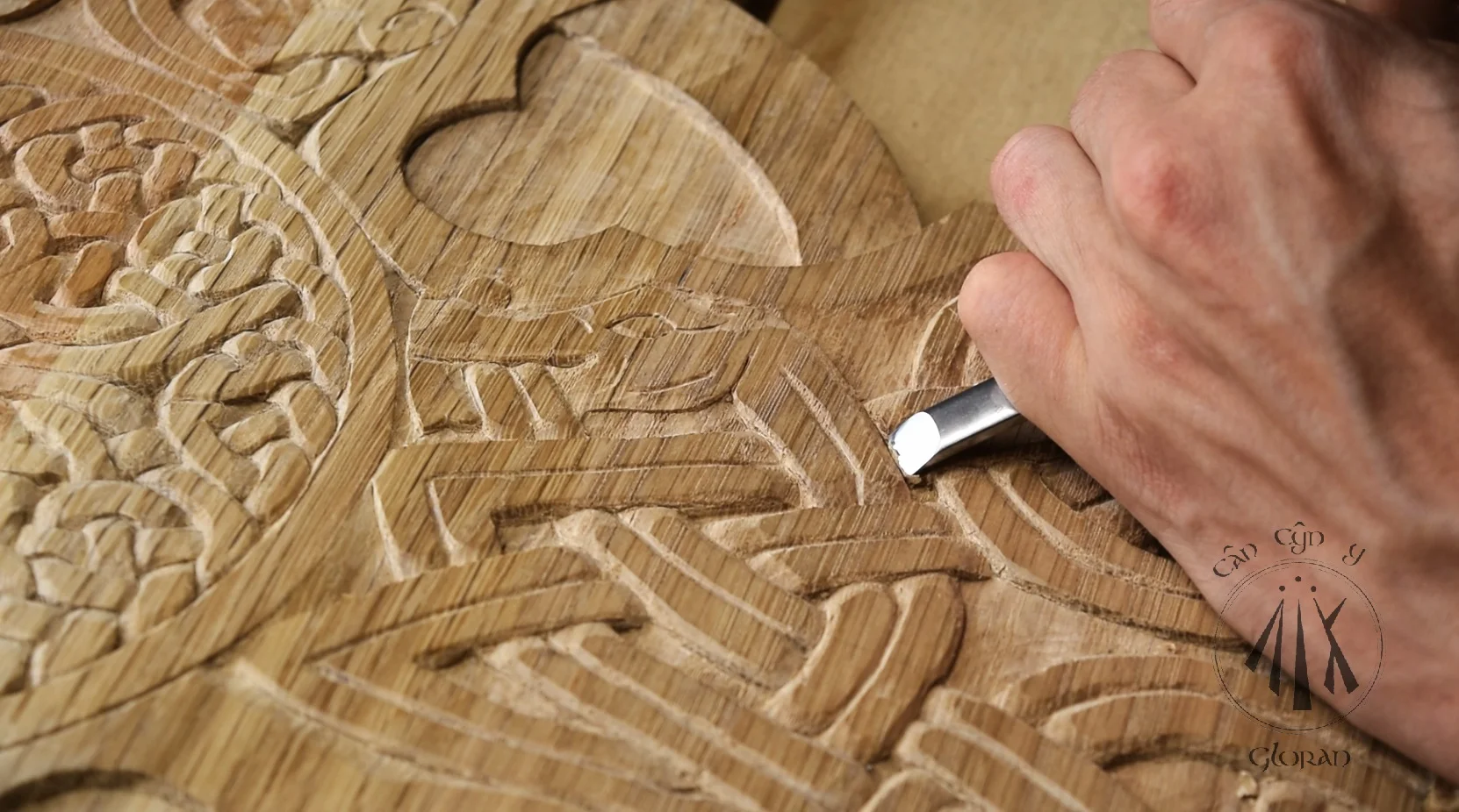 Arwyn of Cân Cŷn y Gloran wood carving an oak replica of the Glamis Pictish stone