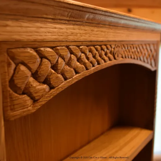 The top of an oak cabinet, hand carved with Celtic knotwork